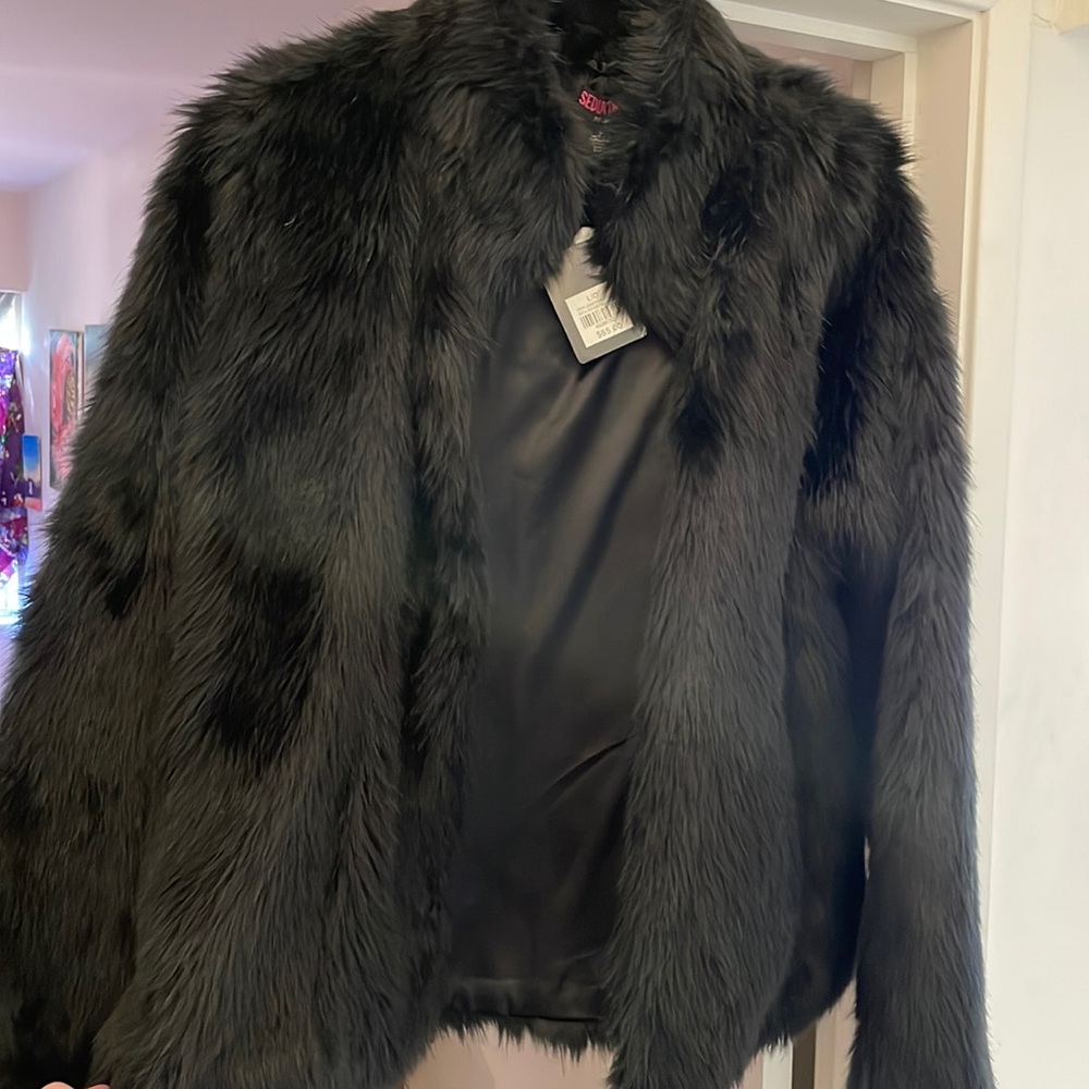 black, faux fur, long-sleeve coat. Brand-new, never-worn, tags still attached!
